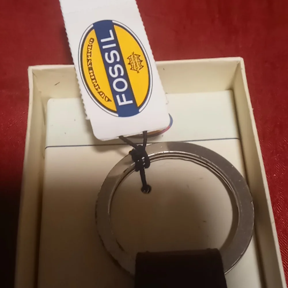 Fossil genuine leather snap key chain.